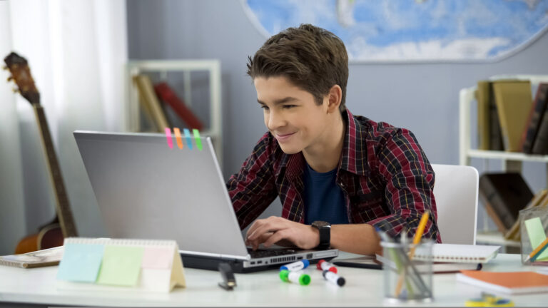 Teen students communicating and collaborating on a project