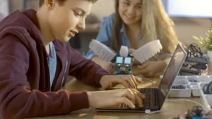 Teen student students coding robot laptop at Love to Code Academy